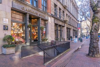 a city street with a gate in front of a building